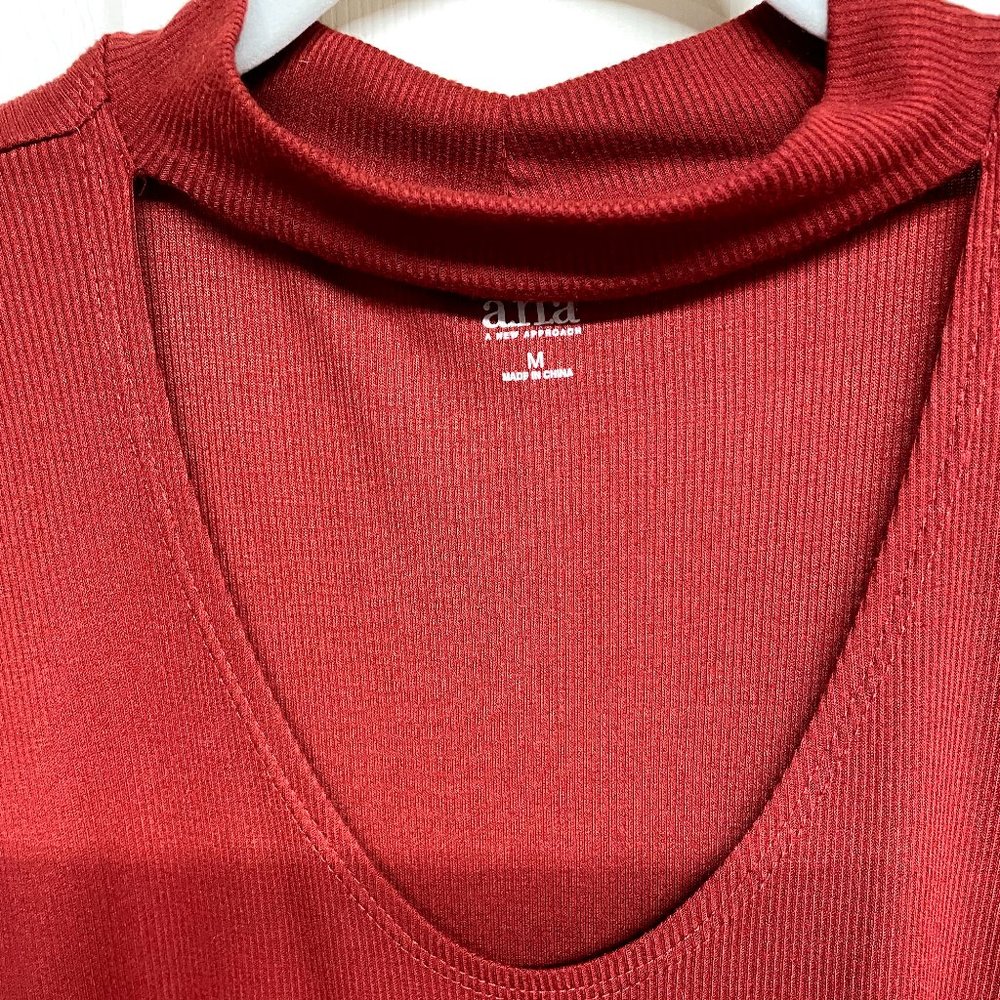 Rust Color Sleeveless Mock neck with deep cut out opening. Medium